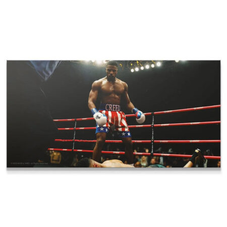 Wide shot of Adonis Creed victorious over a fallen opponent in the ring, titled 'Creed - Who's Next?'.