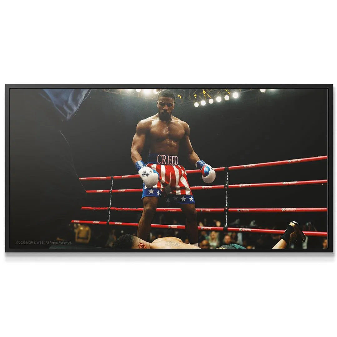 Close-up detail of Adonis Creed's determined face and patriotic boxing shorts for 'Creed - Who's Next?'.