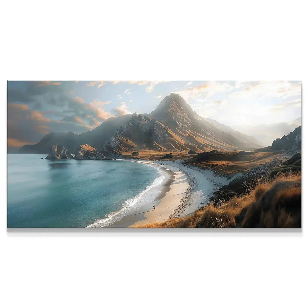 Panoramic view of the sandy Crescent Coast with towering golden mountains in dramatic lighting