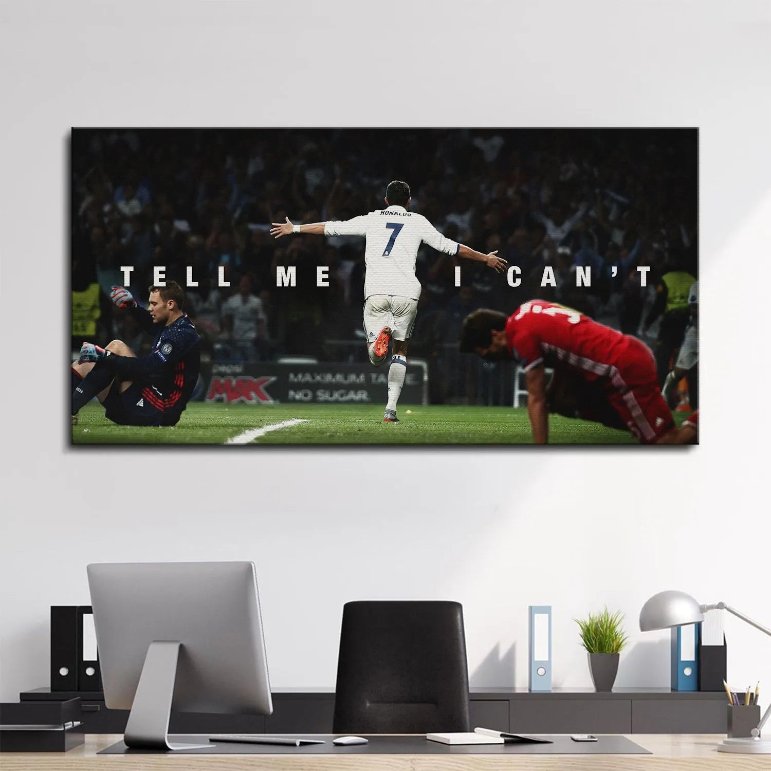 Motivational wall art display in a modern living room featuring the 'Cristiano Ronaldo - Tell Me I Can't' poster.