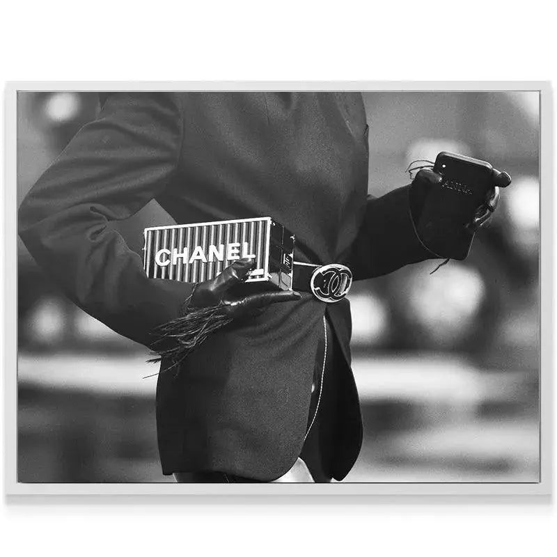 Textured view of the fringed leather glove holding the striped clutch in the 'Cross Walk' print.