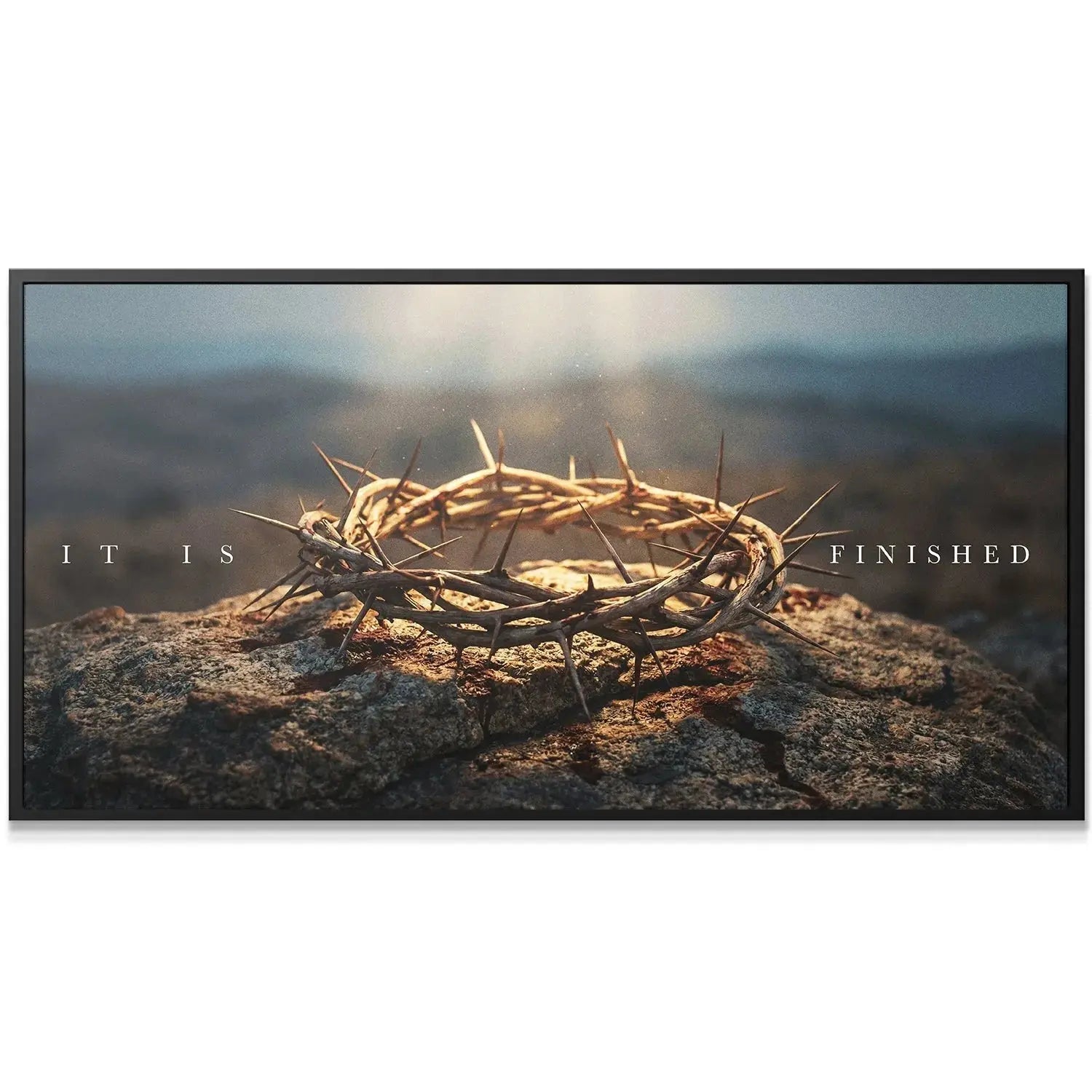 Wide horizontal shot of the 'Crown Of Thorns – It Is Finished' artwork displayed centered in a modern minimalist living room setting.