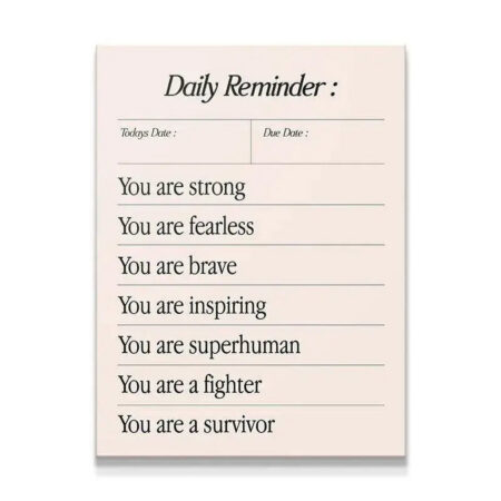 Full overhead studio shot of the minimalist Daily Survivor affirmation notepad design.