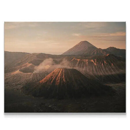 Wide view of the Tengger caldera at Dawn of Bromo, showing multiple volcanic peaks and steam plumes.