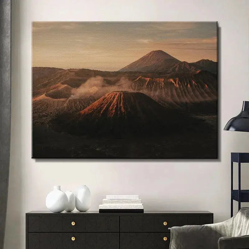 Soft golden light illuminating the sharp ridges and valleys of the volcanoes in Dawn of Bromo artwork.