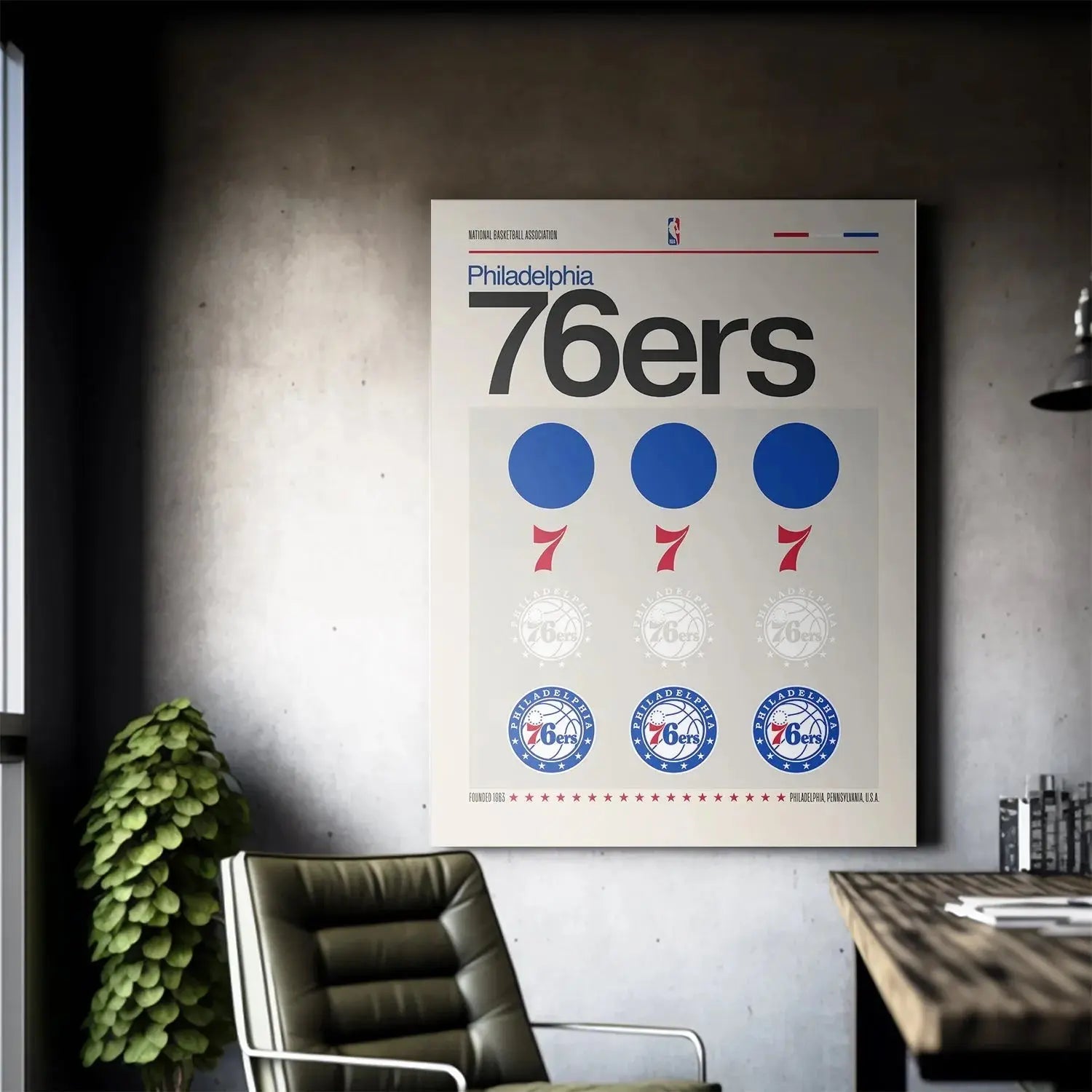 Lifestyle context image showing the framed 'Deconstructed Logo - 76ers' print displayed prominently on a modern white wall.
