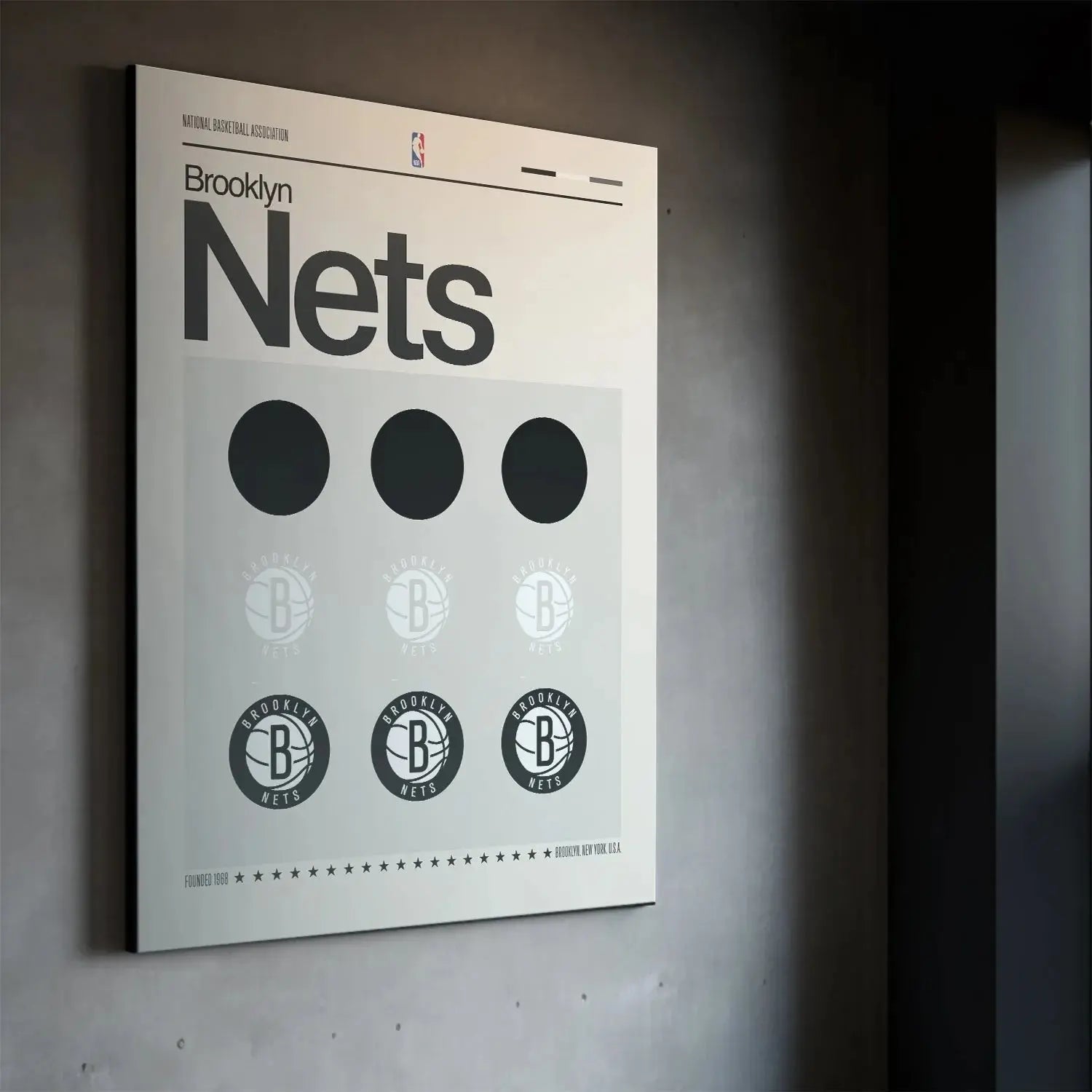 Corner angle photograph of the cream background and black text on the 'Deconstructed Logo - Nets' artwork.