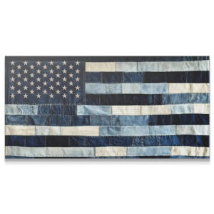 Close-up texture of the stitched patchwork Denim USA Flag fabric details.