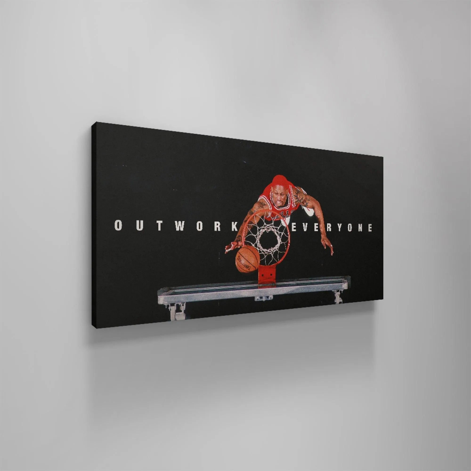 Horizontal perspective of the modern graphic design emphasizing the white typography 'Outwork Everyone' beneath Dennis Rodman.