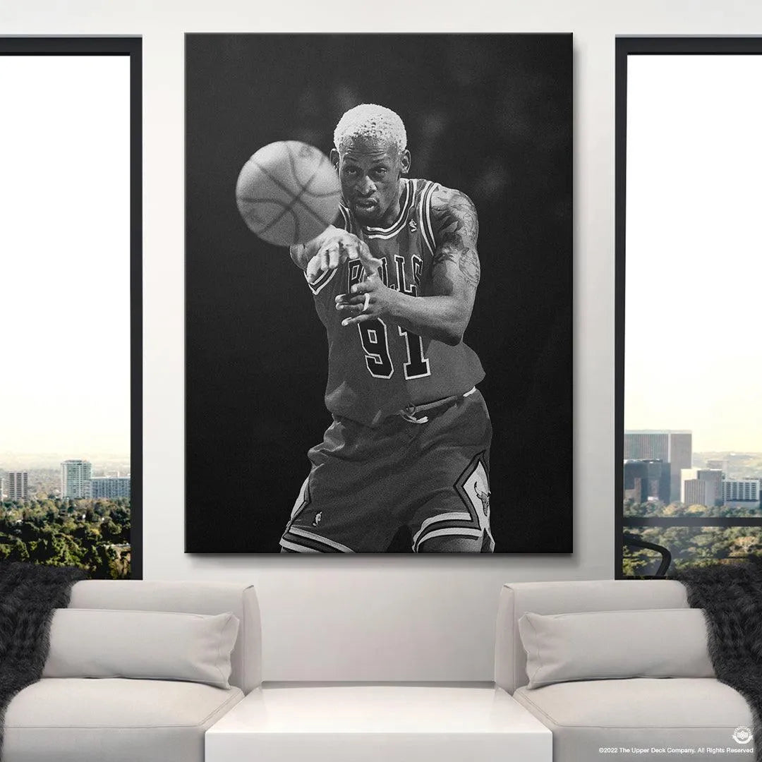 Mid-shot of Dennis Rodman passing the ball, emphasizing his strong defensive stance in Dennis Rodman - Perspective.