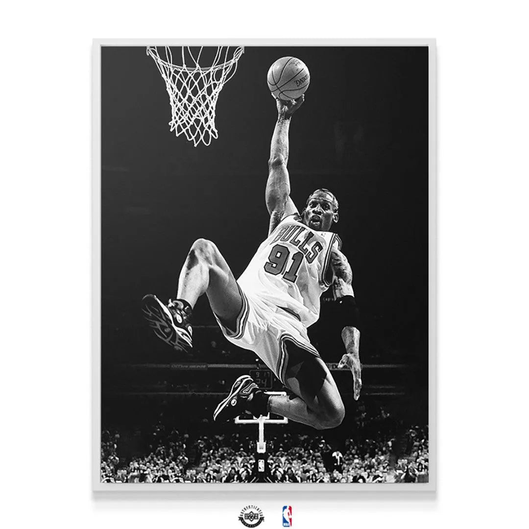 Low-angle shot of Dennis Rodman - Pose capturing the height and power of the Bulls player suspended mid-air.