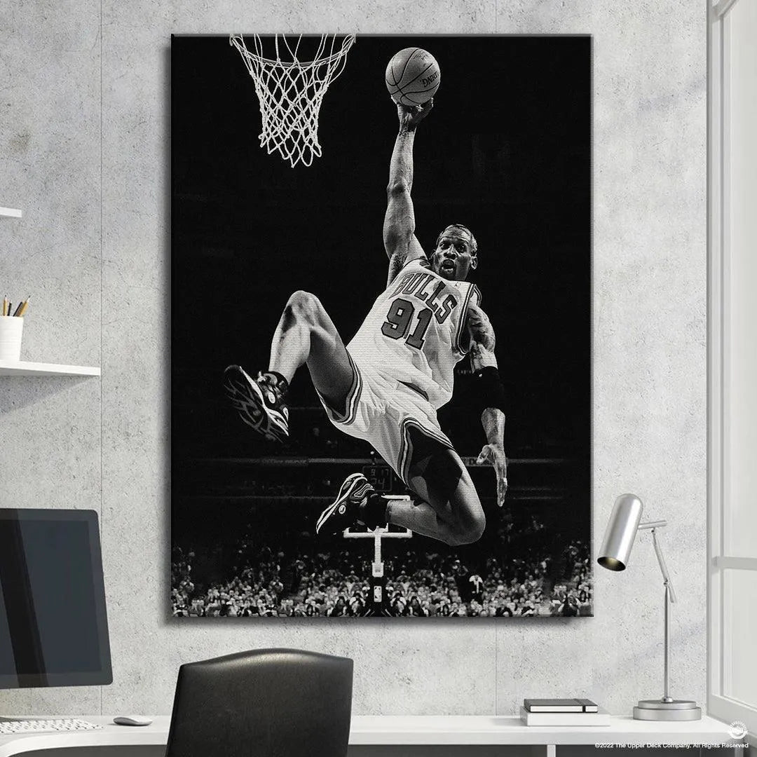 NBA Chicago Bulls legend #91 in the aggressive rebound style Dennis Rodman - Pose, ball held high overhead.