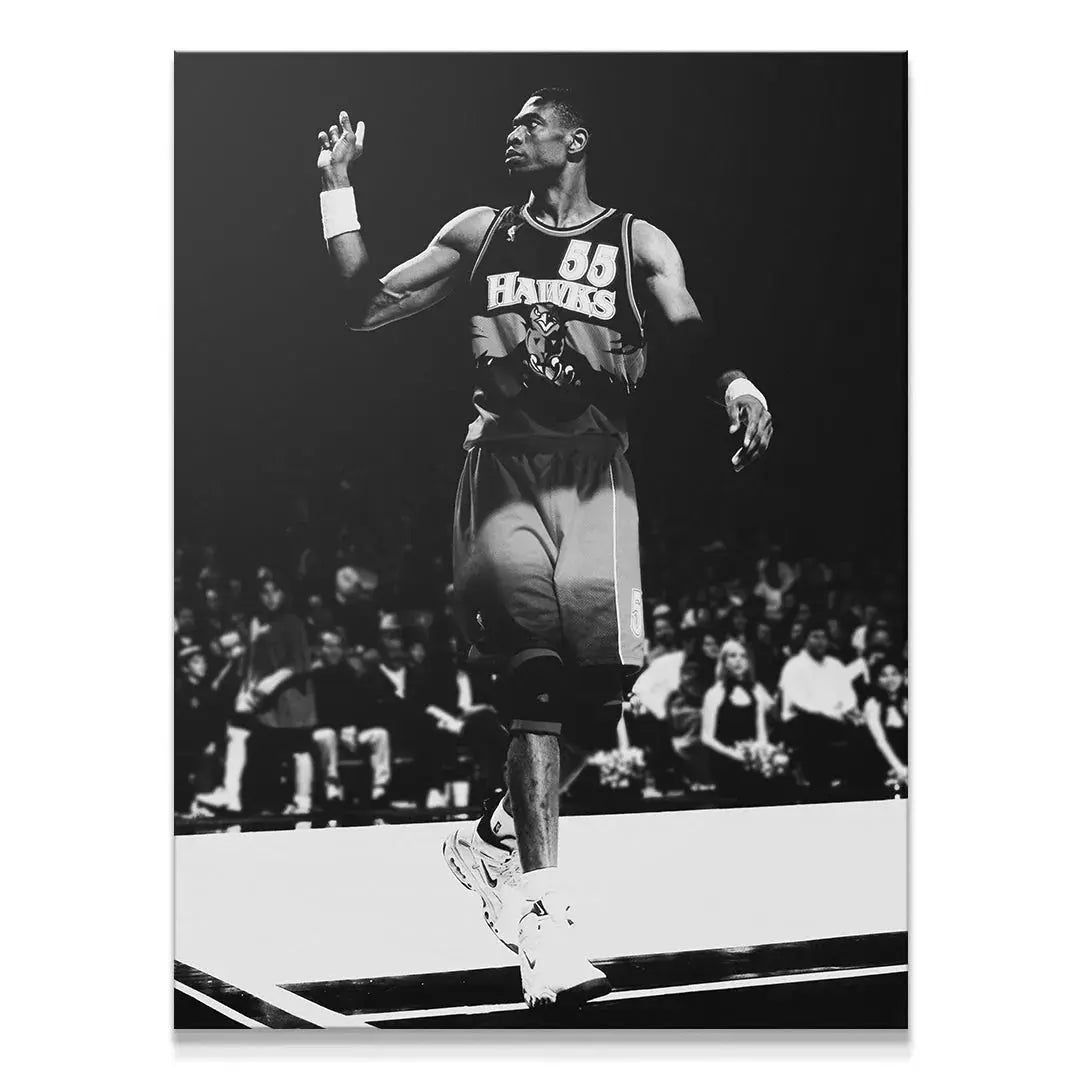 Full-body shot of Dikembe Mutombo - #1 standing confidently on the court, black and white aesthetic.