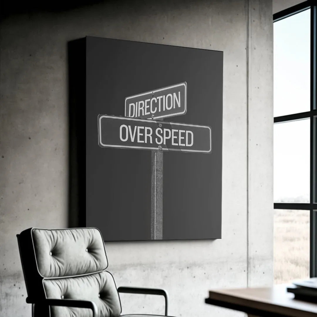 Lifestyle shot of the Direction Over Speed Sign hanging in a modern, light-filled home office environment.