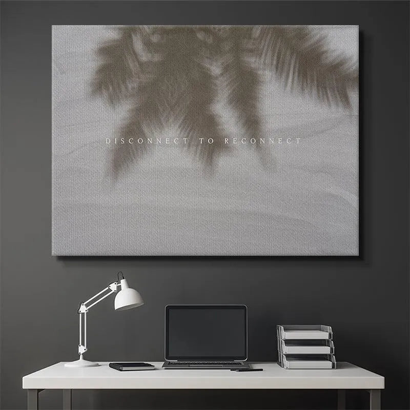Coastal-styled living room featuring the framed 'Disconnect To Reconnect' print centered above a light grey sofa.