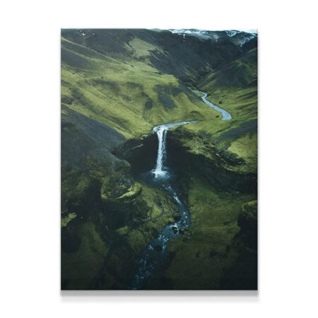 Aerial overview of Icelandic waterfall captured by DJI drone technology.