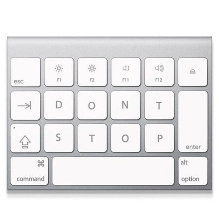 Overhead view of the silver keyboard segment emphasizing the 'Don't Stop' key arrangement.