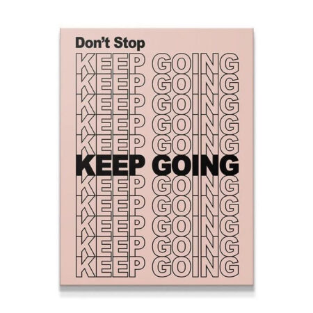Full frontal view of the 'Don't Stop Keep Going' motivational typography print on a pale pink background.