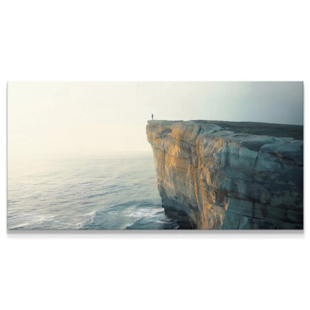 Wide horizontal view of the sheer white rock face of the Dramatic Cliff at golden hour.
