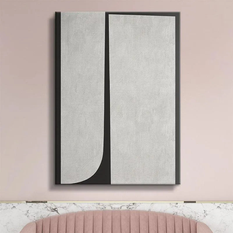 Lifestyle image of Duo Black abstract piece hanging above a minimalist sofa in a living room.