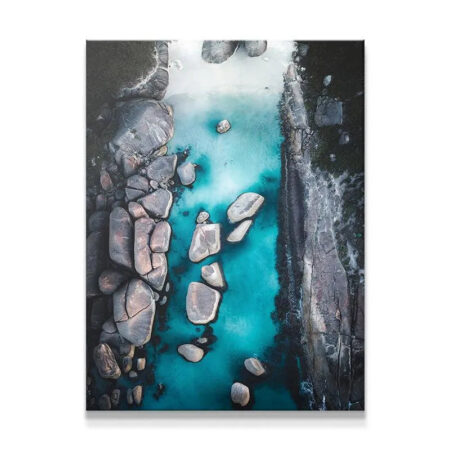 Aerial view capturing the deep turquoise water contrast around Elephant Rocks.