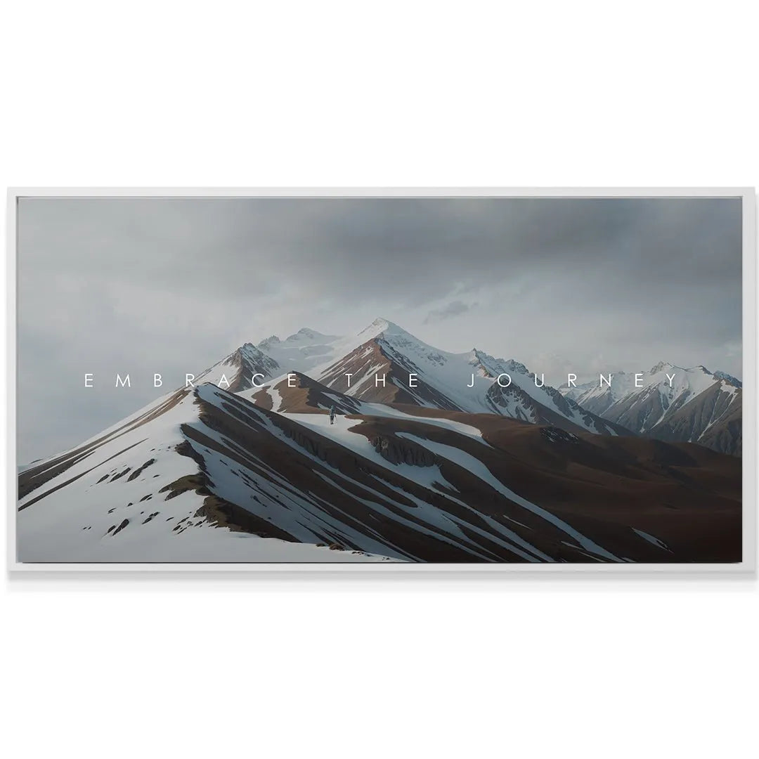 Horizontal perspective of the dramatic mountain ridge under dark, stormy clouds featuring the phrase 'Embrace The Journey'.
