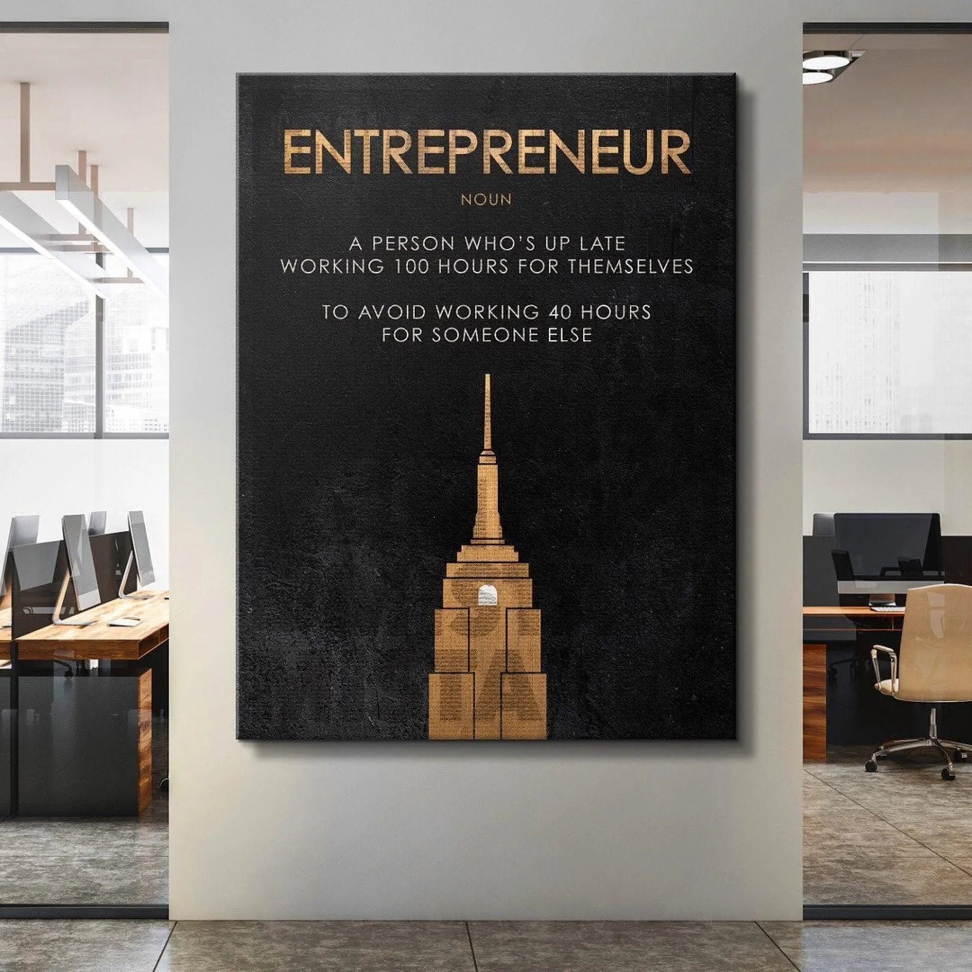 Angled shot showing the reflection off the gold skyscraper icon beneath the word 'Entrepreneur'.