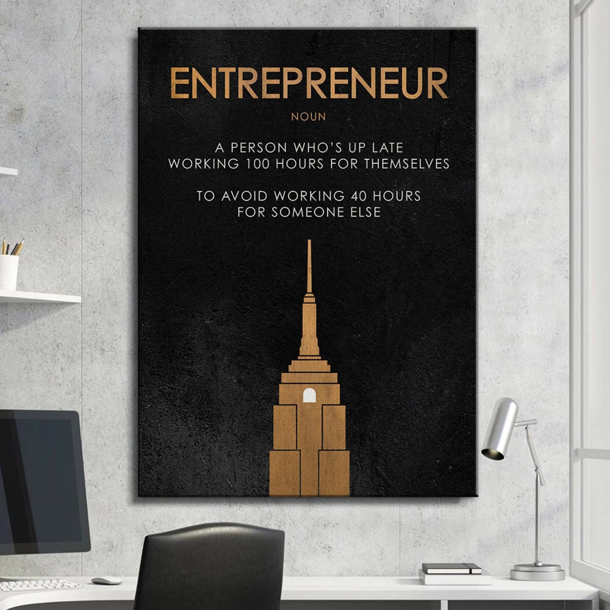 Lifestyle image featuring the Entrepreneur definition print above a modern desk setup.