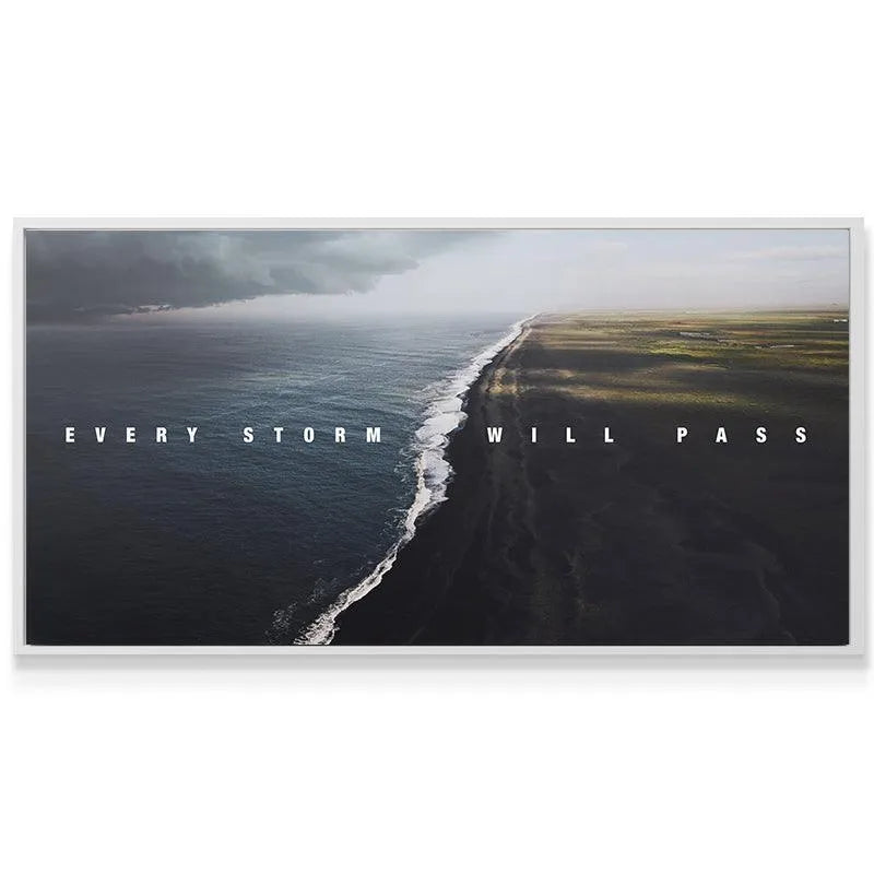 Wide panoramic coastal canvas showing dramatic sky and the hope-filled phrase Every Storm Will Pass.