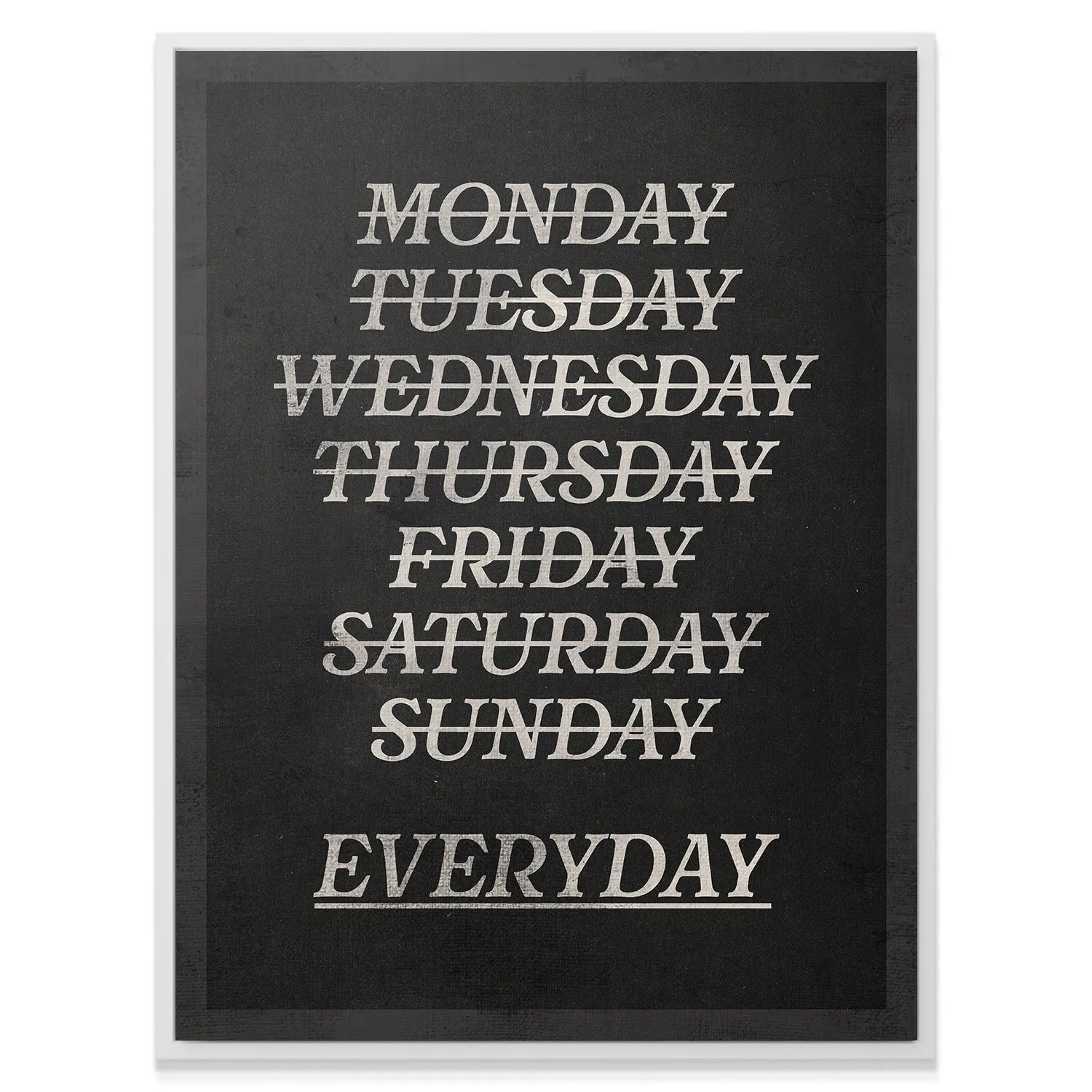 A lifestyle shot of the organizational Every day calendar poster hung in a modern kitchen.