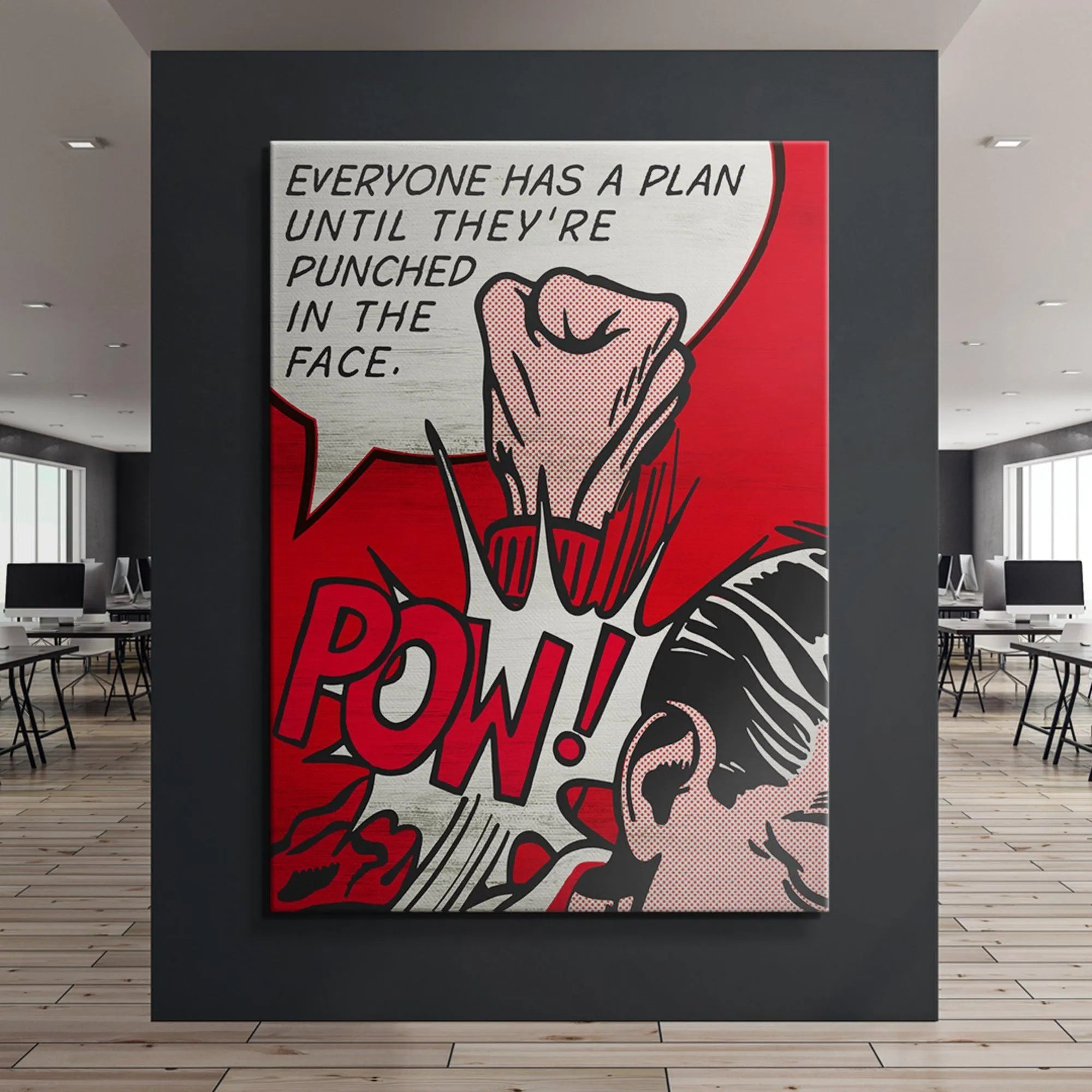 Tight crop focusing on the striking fist and comic burst graphic accompanying 'Everyone Has A Plan' text.
