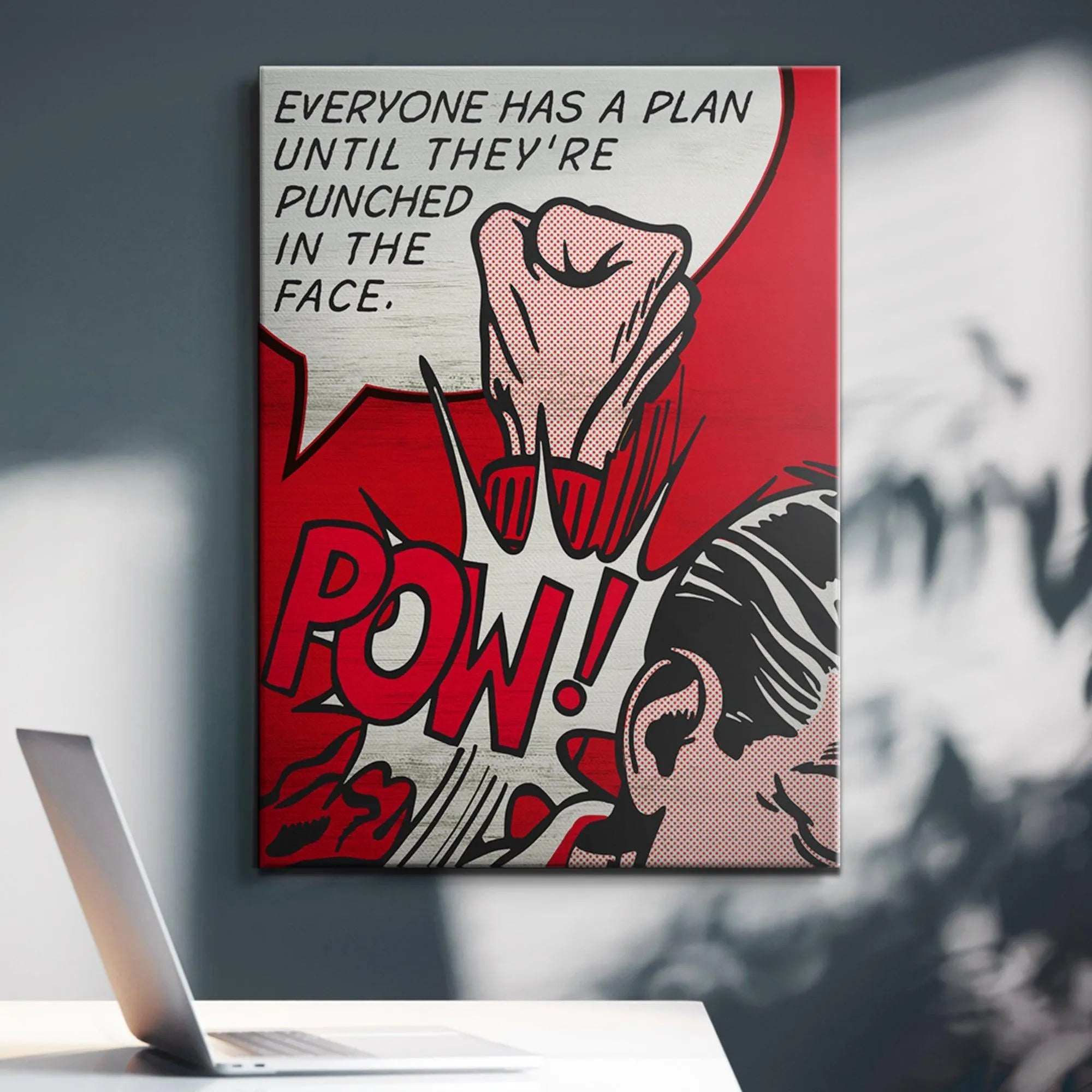 High-contrast image centered on the red "POW!" text bubble next to the powerful message 'Everyone Has A Plan'.