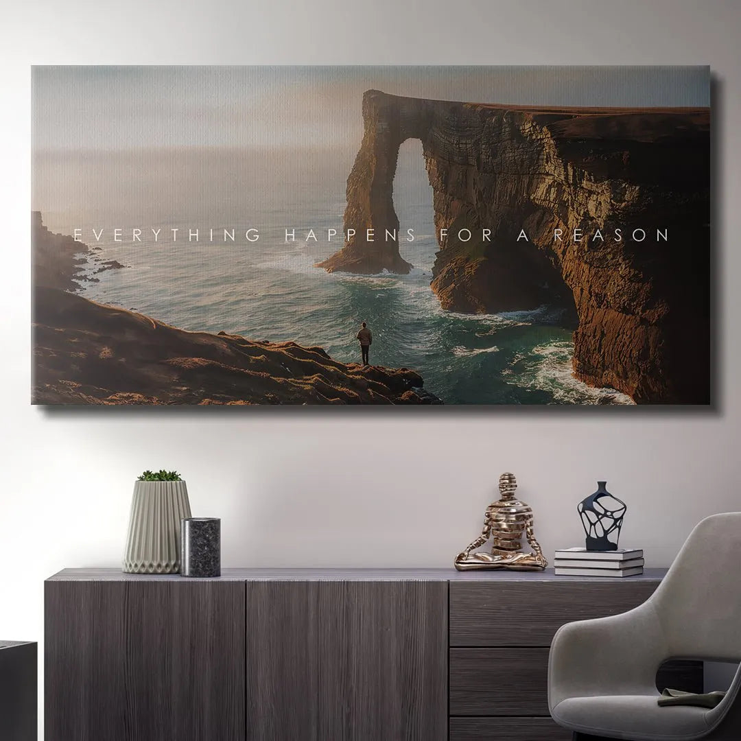 Vibrant color detail of the soft sunrise or sunset glow illuminating the cliff and the powerful text Everything Happens For A Reason.