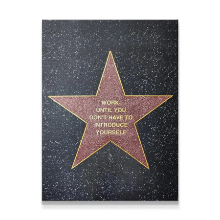 Full view of the 'Fame' inspirational star canvas with motivational gold lettering against a speckled black background.
