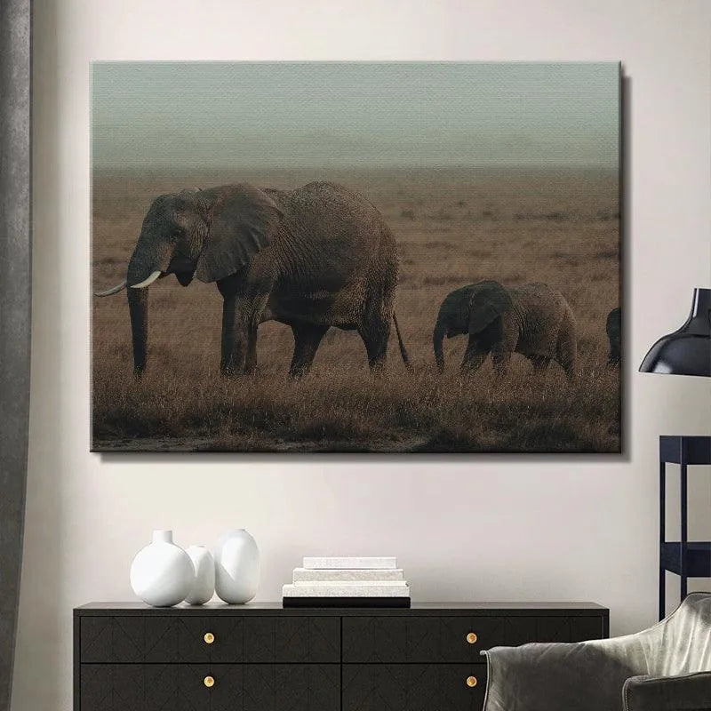 Low-angle perspective highlighting the dry, tall African grass surrounding the elephants during their Family Strolls.