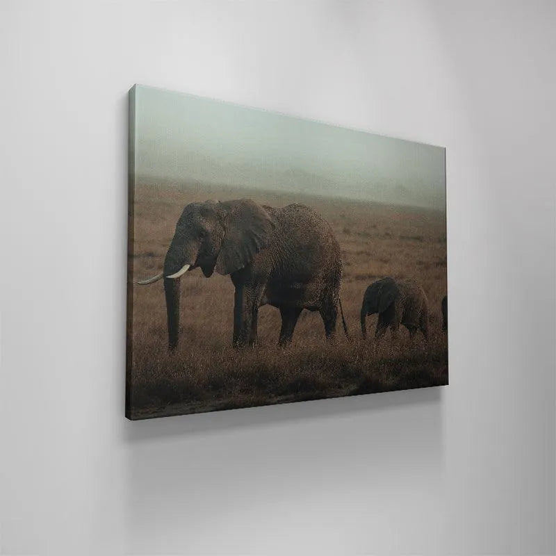 Profile view of the entire elephant procession during their peaceful Family Strolls across the vast, open plains.