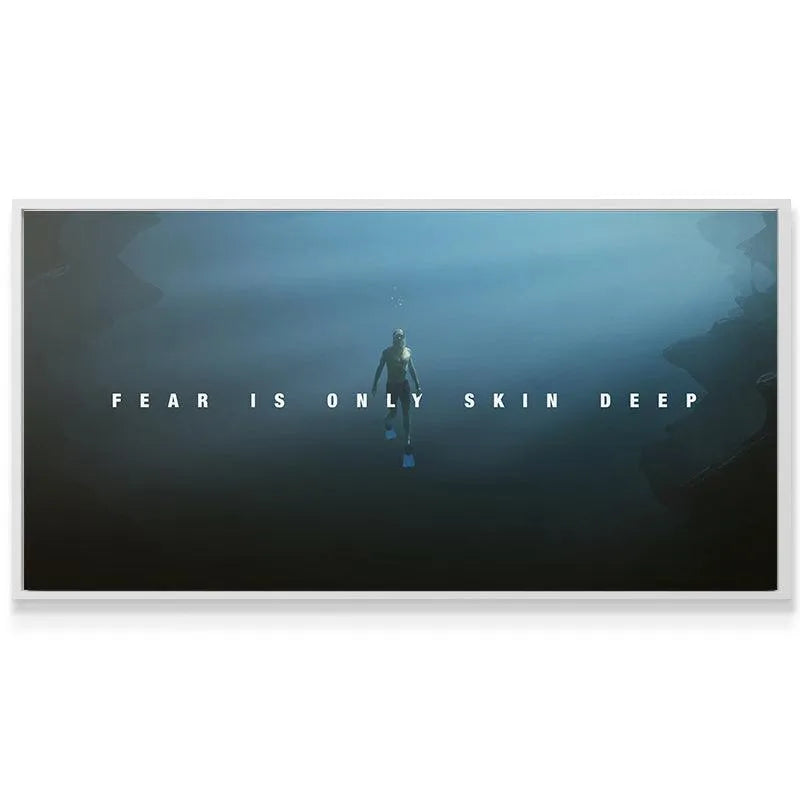 High-angle view showing the solitary diver submerged with the motivational quote 'Fear Is Only Skin Deep'