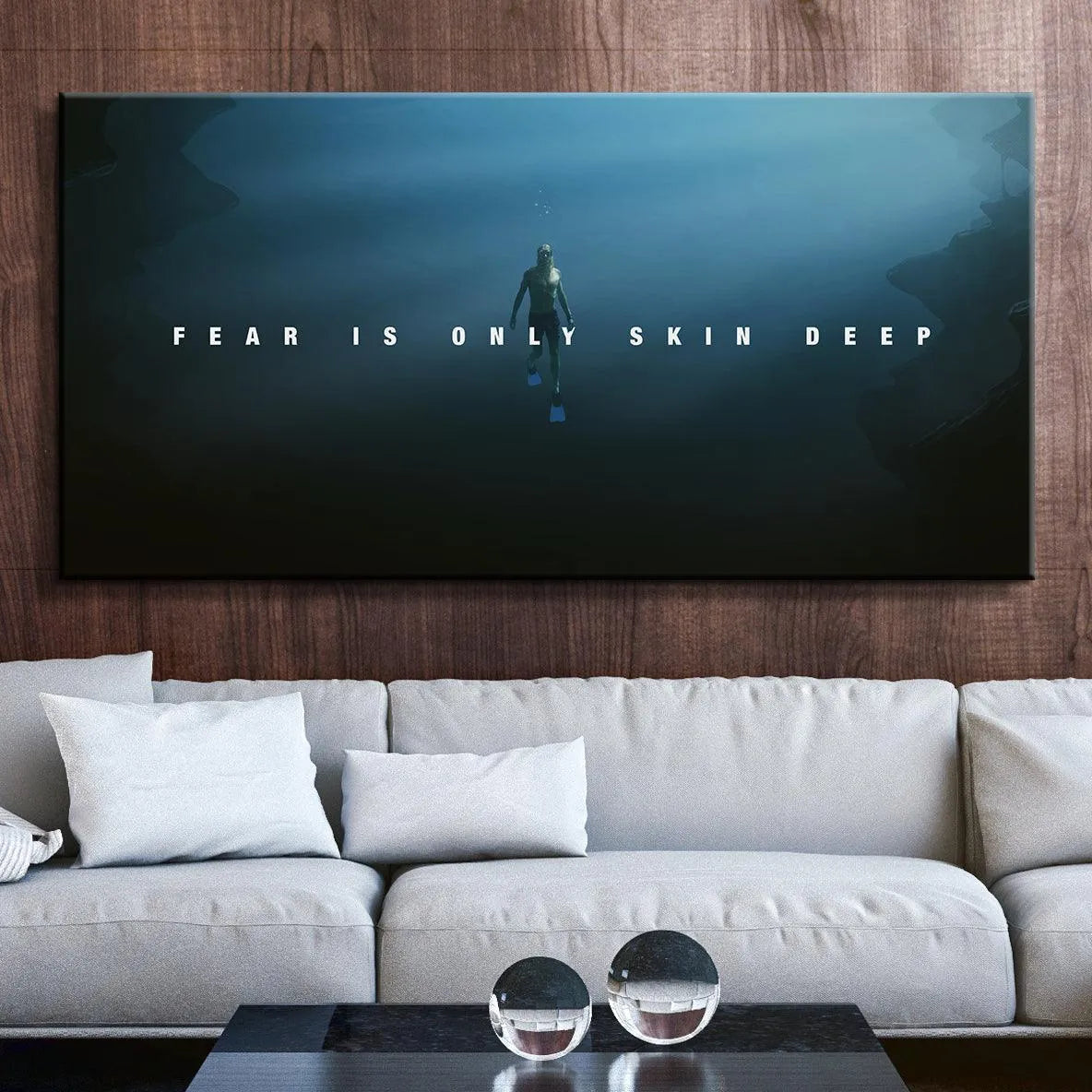 Lifestyle mock-up of the 'Fear Is Only Skin Deep' wall art hanging above a modern desk setup