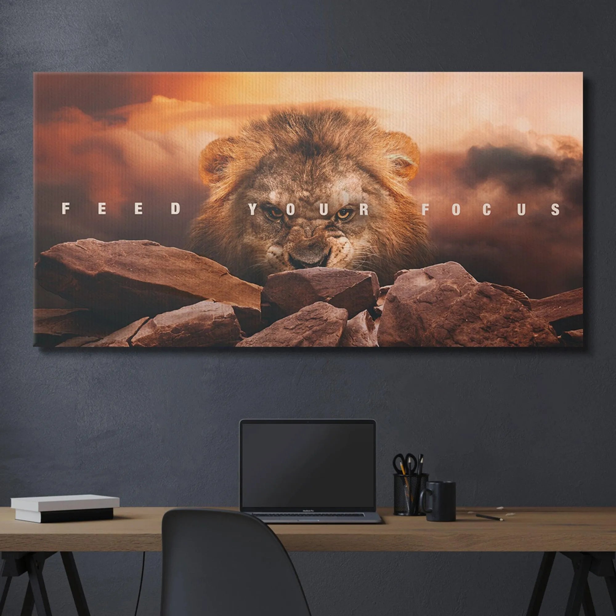 Professional office desk setup featuring the 'Feed Your Focus' artwork centered above a minimalist workspace.