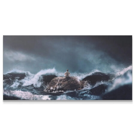 Find Calm In The Chaos (No Quote) wide landscape view of figure on rock surrounded by turbulent ocean waves.