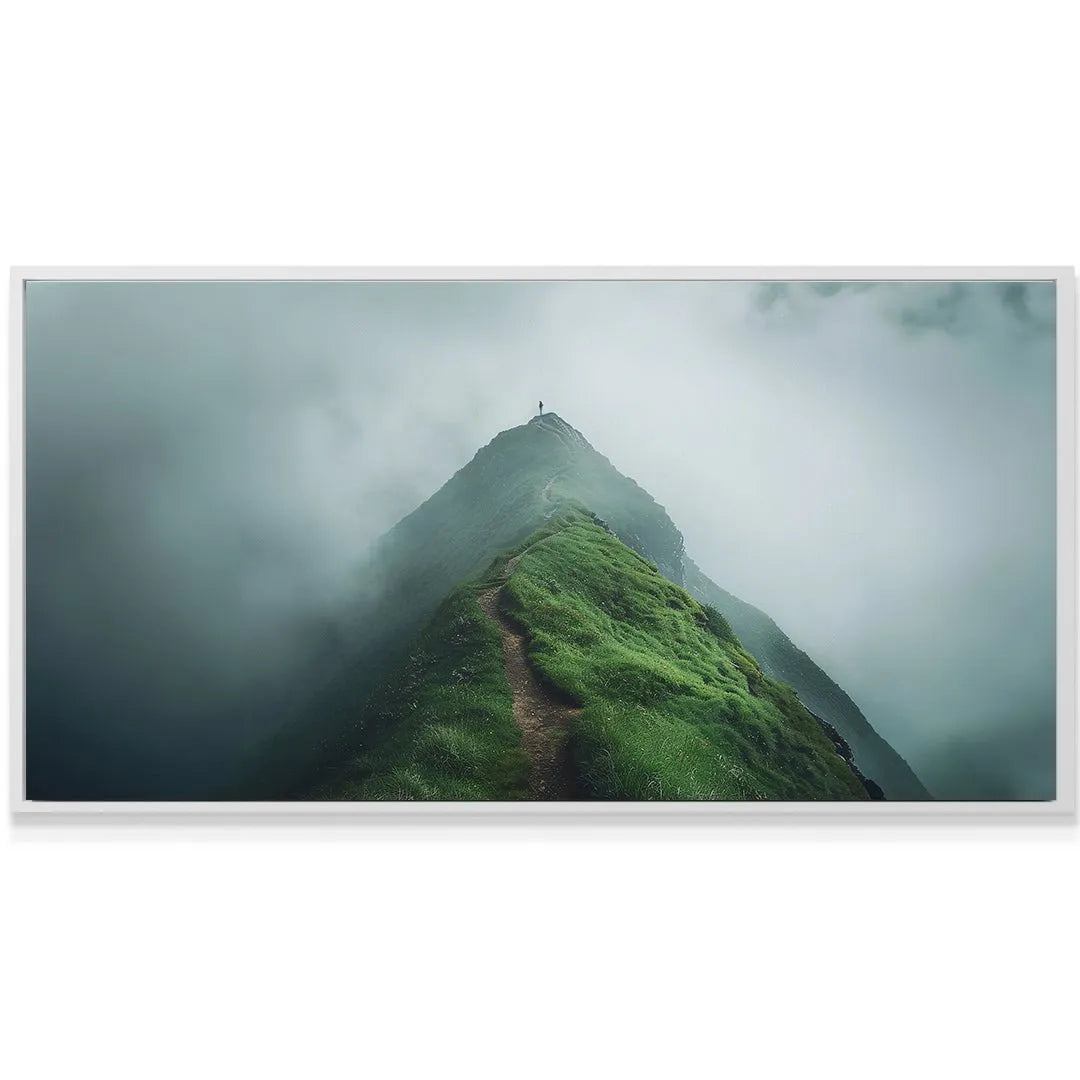 Close-up of the atmospheric fog rolling over the mountain ridge beneath the inspirational reminder to Finish The Climb.