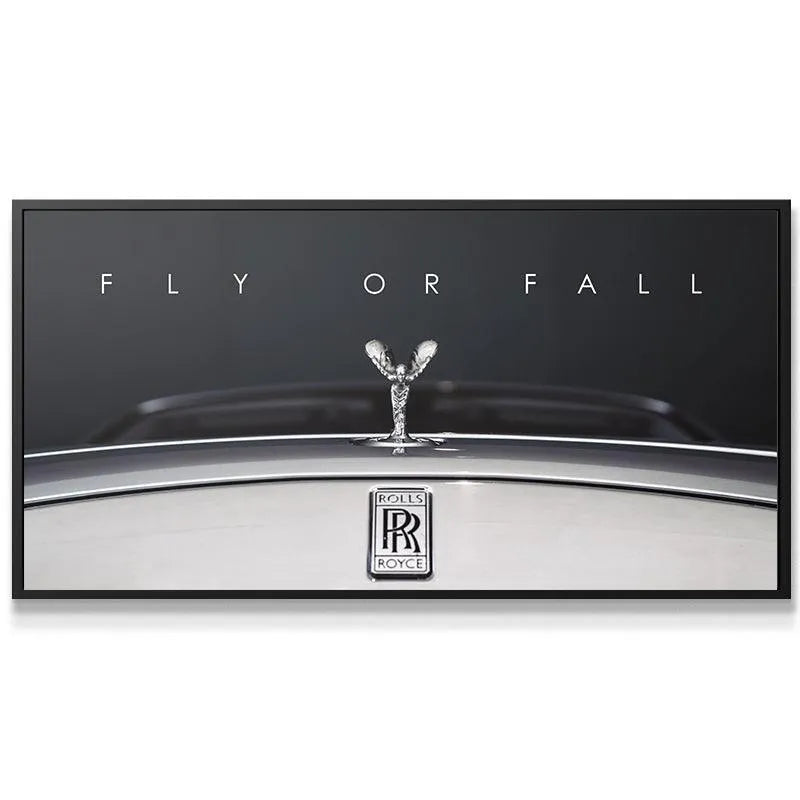 Rolls-Royce hood ornament reflecting light, emphasizing the choice to 'Fly Or Fall'.