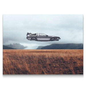Cinematic long shot of the metallic gray Flying Object over vast amber fields in Iceland.