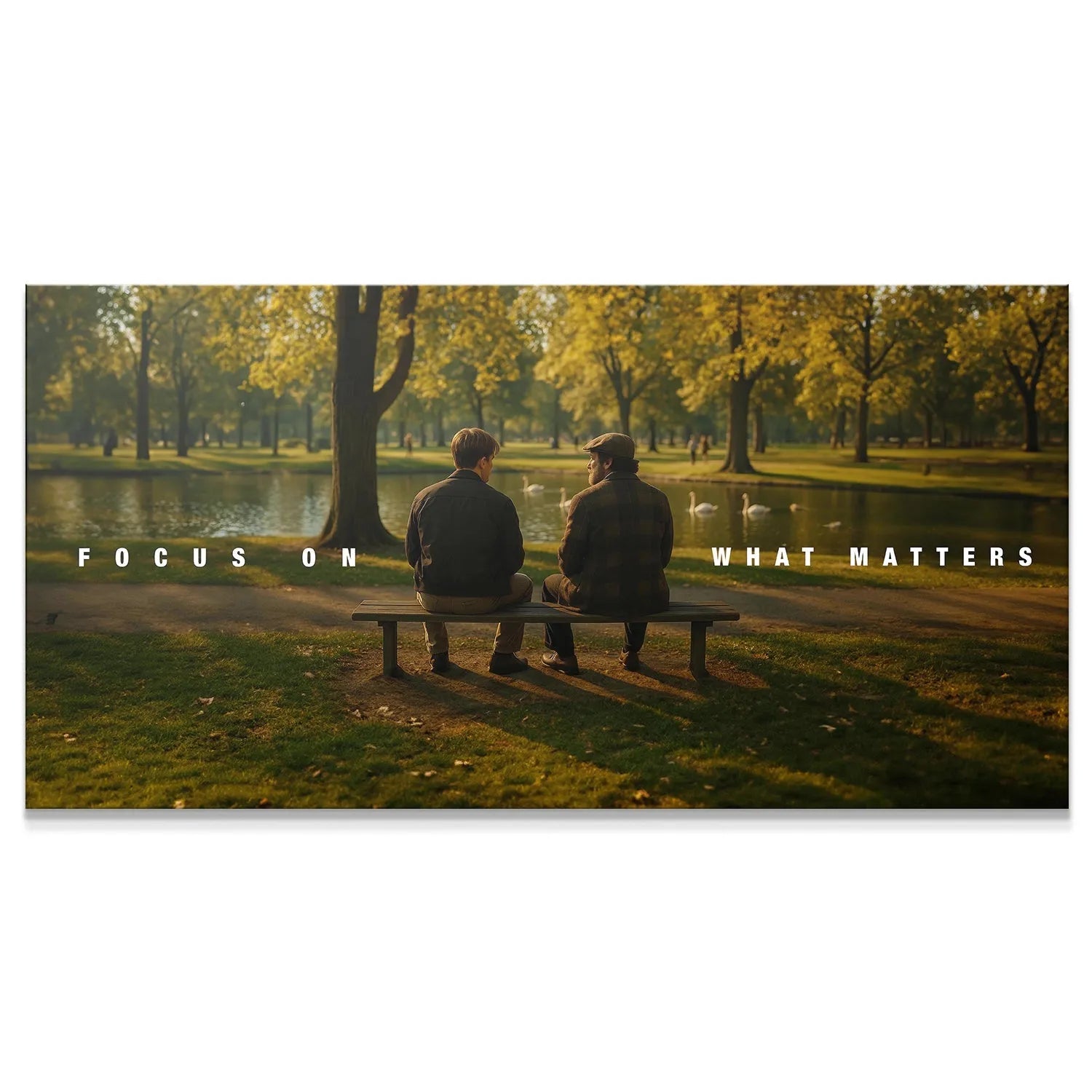 Wide shot of two men sitting on a park bench facing a tranquil lake, emphasizing the importance of 'Focus On What Matters' in life.