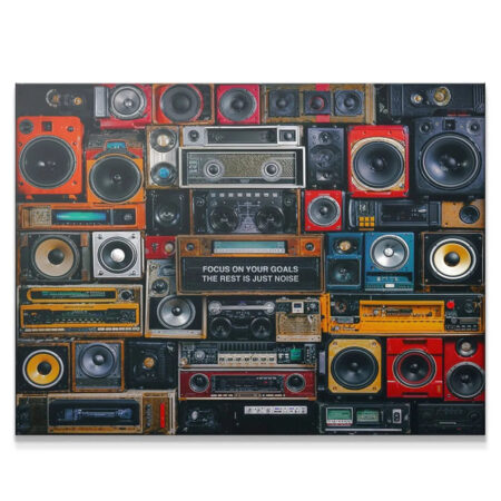 Vintage audio wall print reading 'Focus On Your Goals The Rest Is Just Noise' in an office setting.