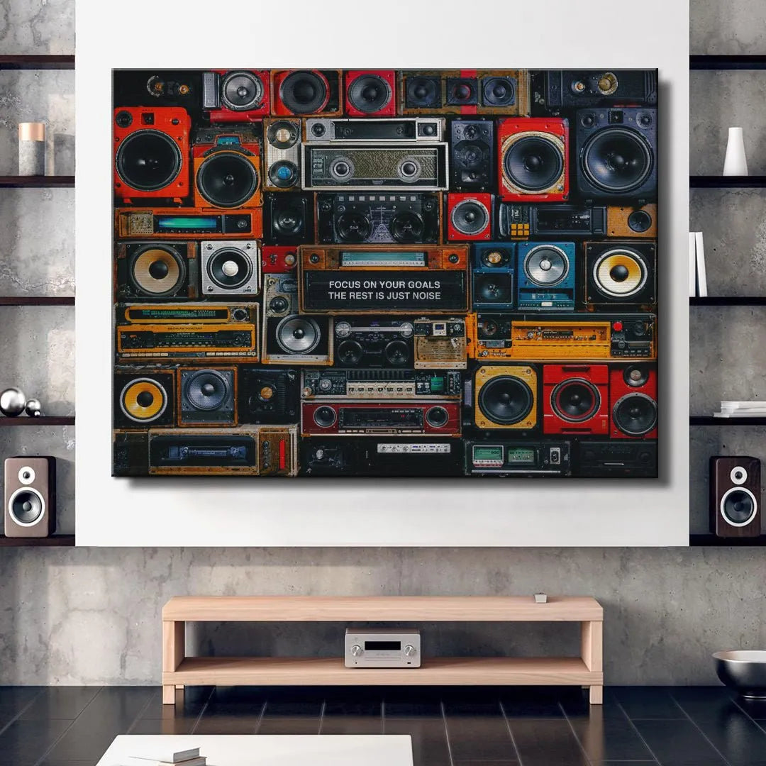 Angular perspective of the dense array of vintage woofers and amplifiers, driving the message 'Focus On Your Goals'.