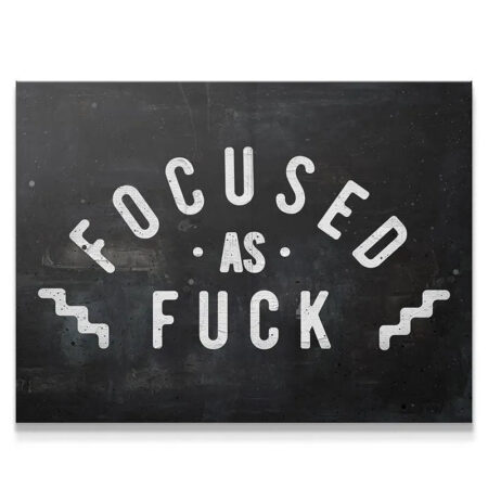 Motivational print close-up showcasing the distressed texture of the "Focused As Fuck" typography.
