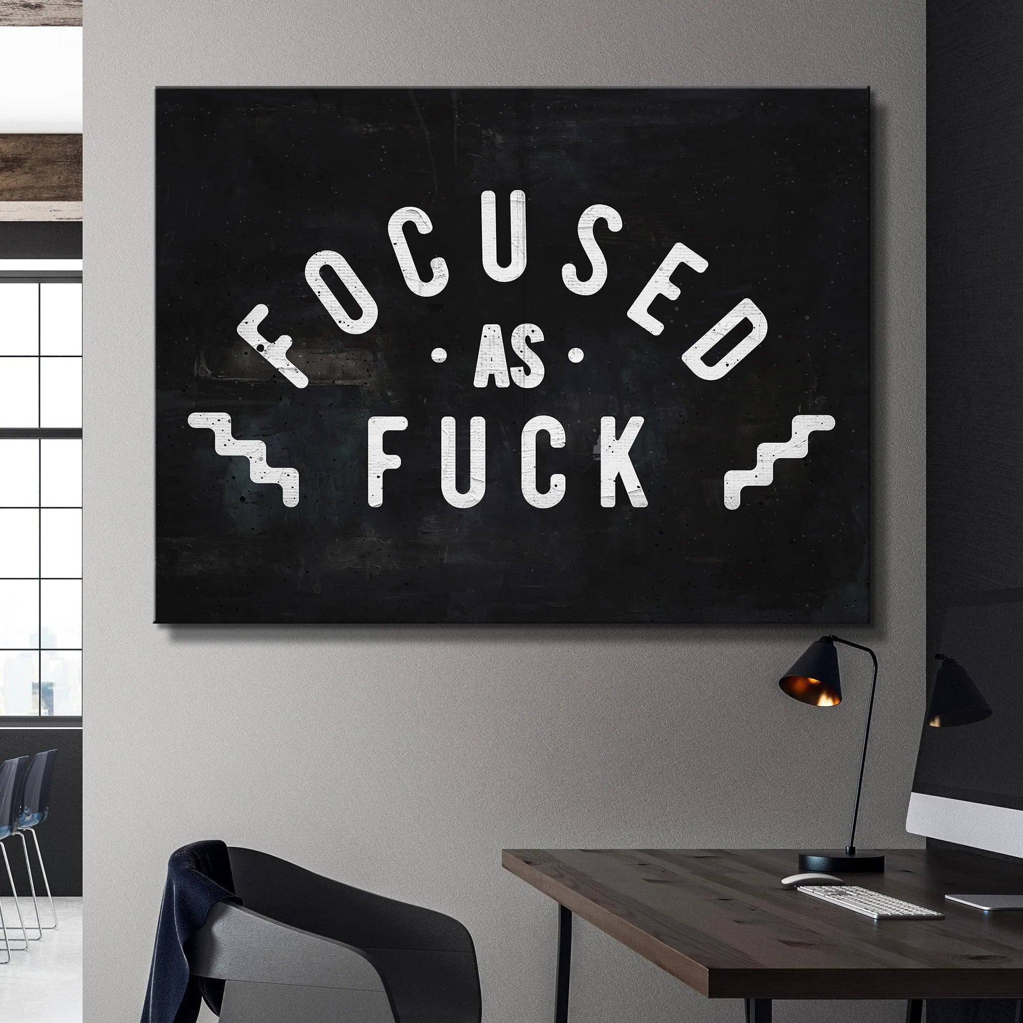 Extreme detail crop showing the white speckle effect on the black background of "Focused As Fuck" print.