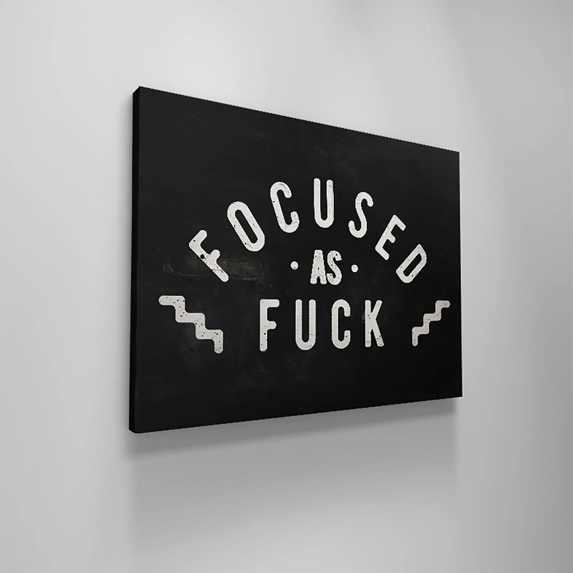 The rectangular canvas featuring the industrial, edgy lettering of "Focused As Fuck" centered.