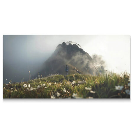 Panoramic view of a solitary hiker on a grassy ridge path during a Foggy Hike.